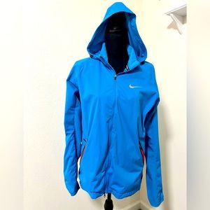 Nike running turquoise jacket, zipper pockets and hood.